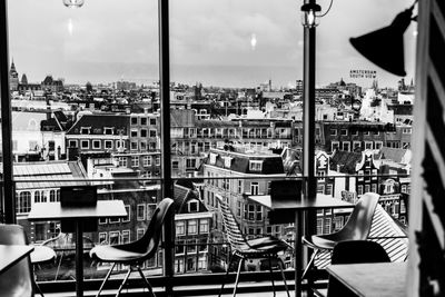 Panoramic view of restaurant and buildings against sky