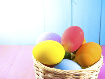 Close-up of colorful easter eggs in wicker basket