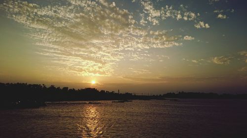 Scenic view of silhouette trees against sky during sunset