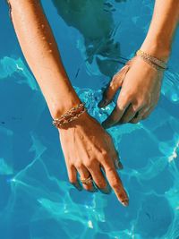 Low section of woman in swimming pool