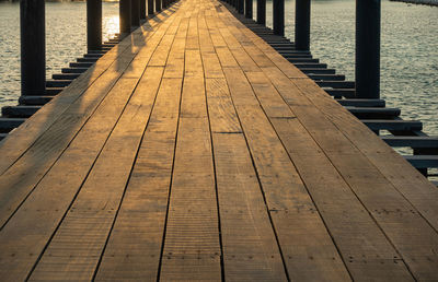 Surface level of wooden pier over sea