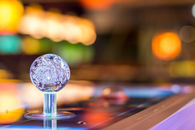 Close-up of glass decoration on table in nightclub