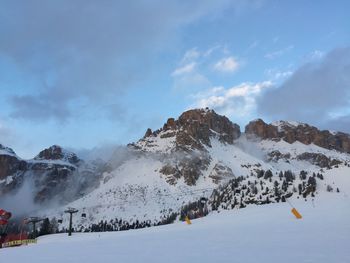 Snow covered mountains against sky