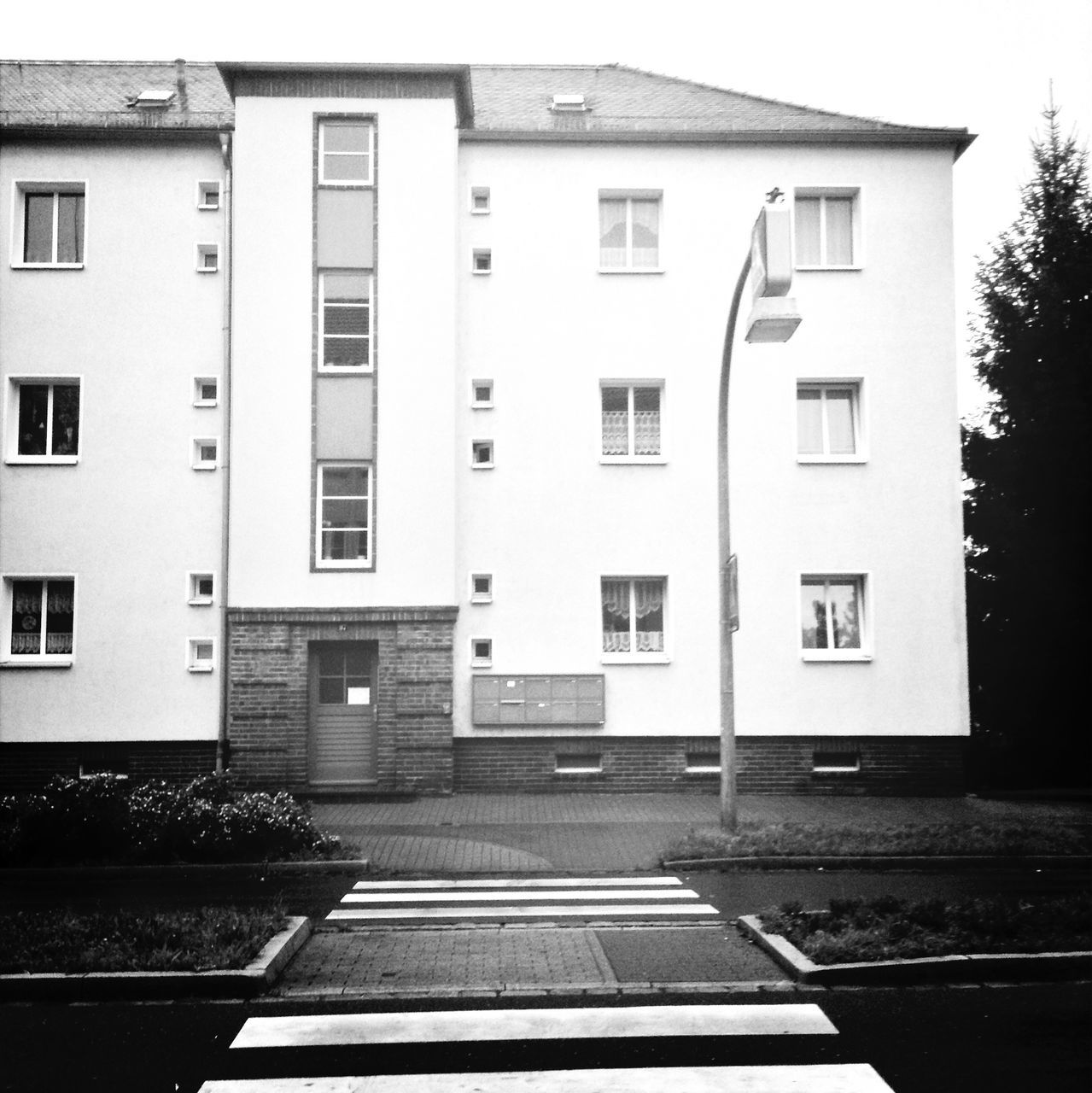 architecture, built structure, building exterior, window, residential building, building, transportation, residential structure, street, house, city, day, no people, the way forward, outdoors, empty, road, railing, tree, glass - material