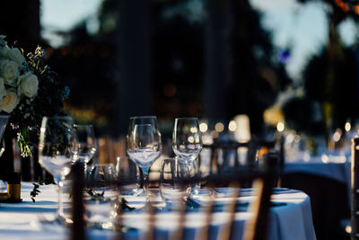 Luxury table settings for fine dining with and glassware, pouring wine to glass.beautiful background