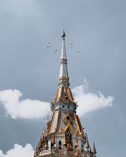 Low angle view of bell tower against sky