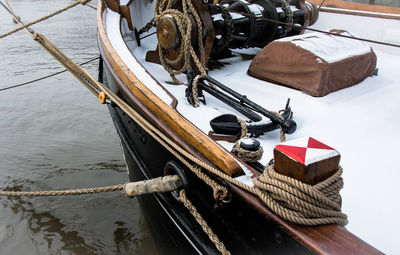 High angle view of snow covered boat moored at harbor