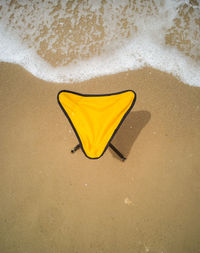 High angle view of stool on beach