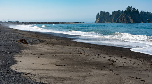 Scenic view of beach against clear sky