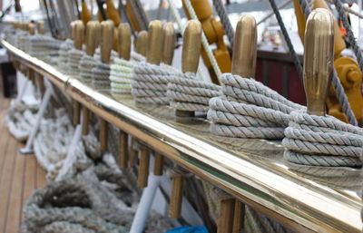 Close-up of ropes tied on wood