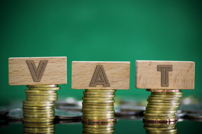 Close-up of text and coins on table