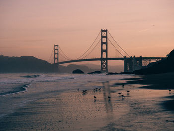 View of suspension bridge at beach