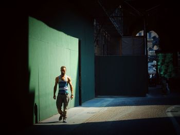 Full length of woman standing by railing