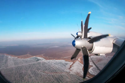 Propeller turbo propeller aircraft. view through porthole.