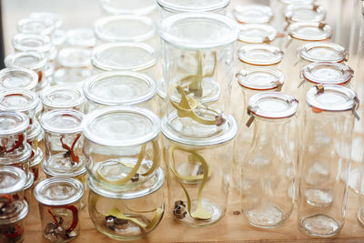 Empty glass containers on table at cafe