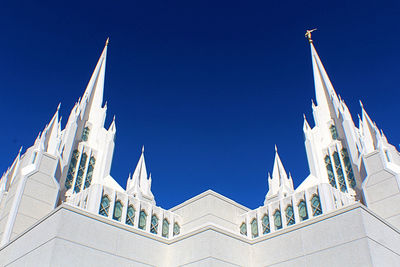 Low angle view of buildings against blue sky