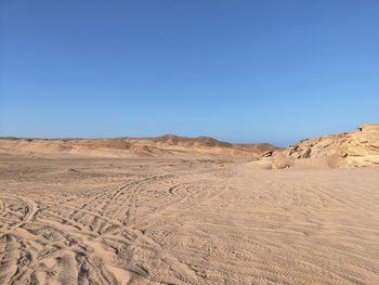 Scenic view of desert against clear sky