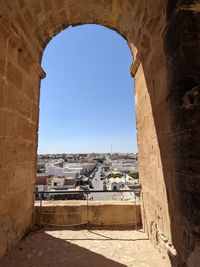 Buildings in city against clear sky