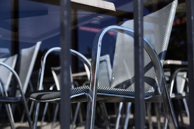 Modern chair from fine restaurant photographed through glass pane from road next door