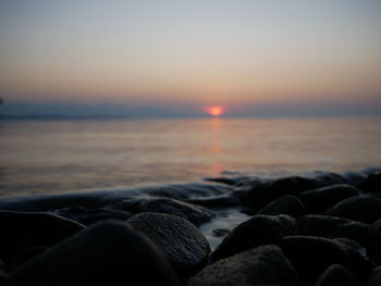 Close-up of pebbles at sunset