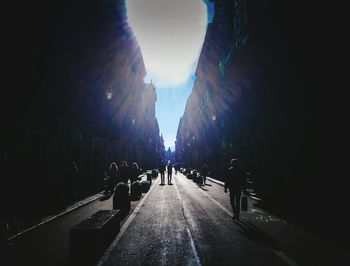 Panoramic view of people walking on road