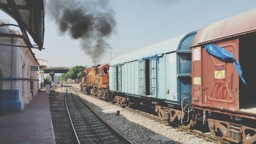 Train on railroad tracks against sky