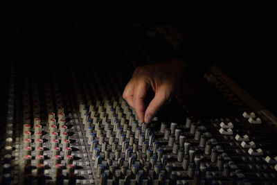 Close-up of man controlling sound mixer