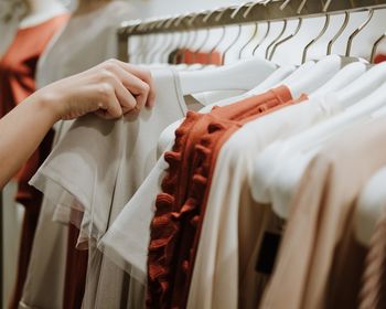 Midsection of man hanging in store