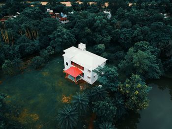 High angle view of building by trees in forest