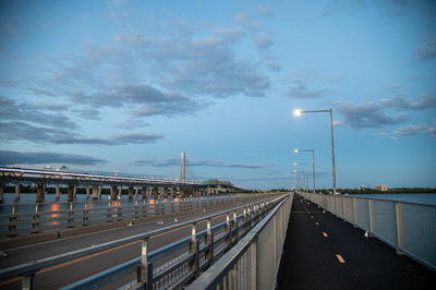 View of bridge over street against sky