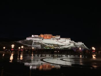 Illuminated buildings in city at night