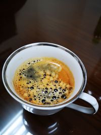 High angle view of coffee cup on table