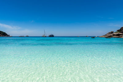Scenic view of sea against blue sky