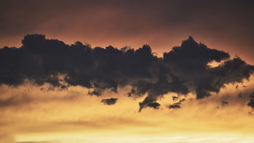 Low angle view of dramatic sky during sunset