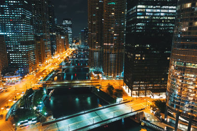 High angle view of illuminated cityscape at night