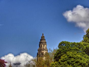 Low angle view of building against blue sky