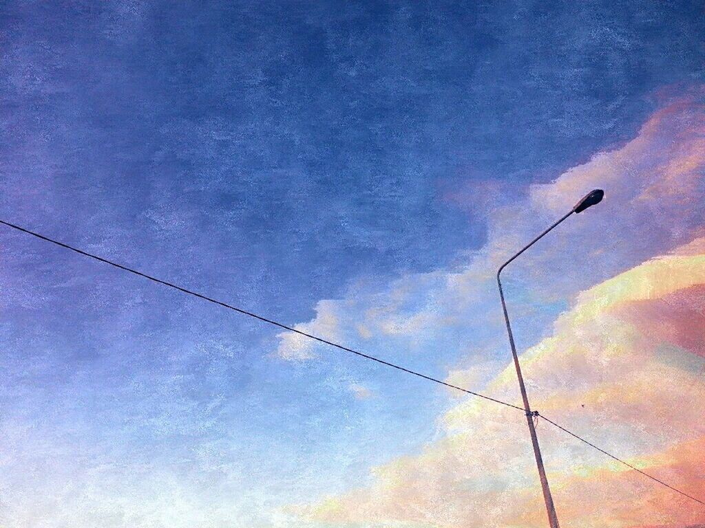 low angle view, power line, sky, electricity, cable, power supply, cloud - sky, electricity pylon, connection, blue, street light, lighting equipment, cloudy, power cable, nature, cloud, silhouette, beauty in nature, dusk, technology