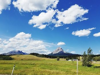 Scenic view of landscape and mountains against sky