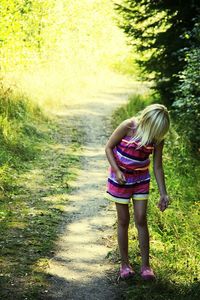 Full length of woman standing on grass