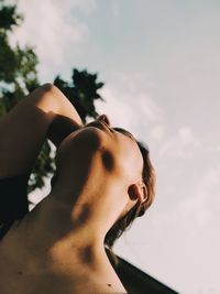 Low angle view of woman against sky