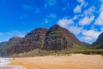 Scenic view of beach against blue sky