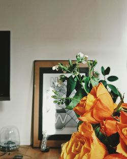 Close-up of flower vase on table at home