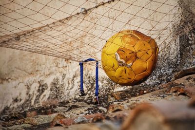 Damaged soccer ball on roof