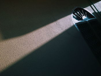 High angle view of shadow on floor