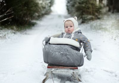 Girl sitting in snow