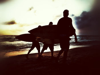 Silhouette of people on beach