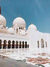 Grand mosque against blue sky