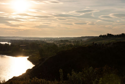 Scenic view of landscape against sky during sunset