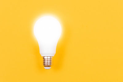Close-up of illuminated light bulb