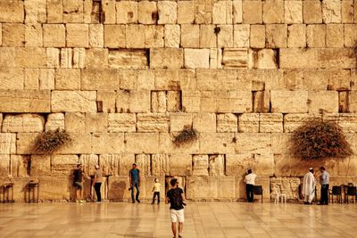 Tourists in front of building